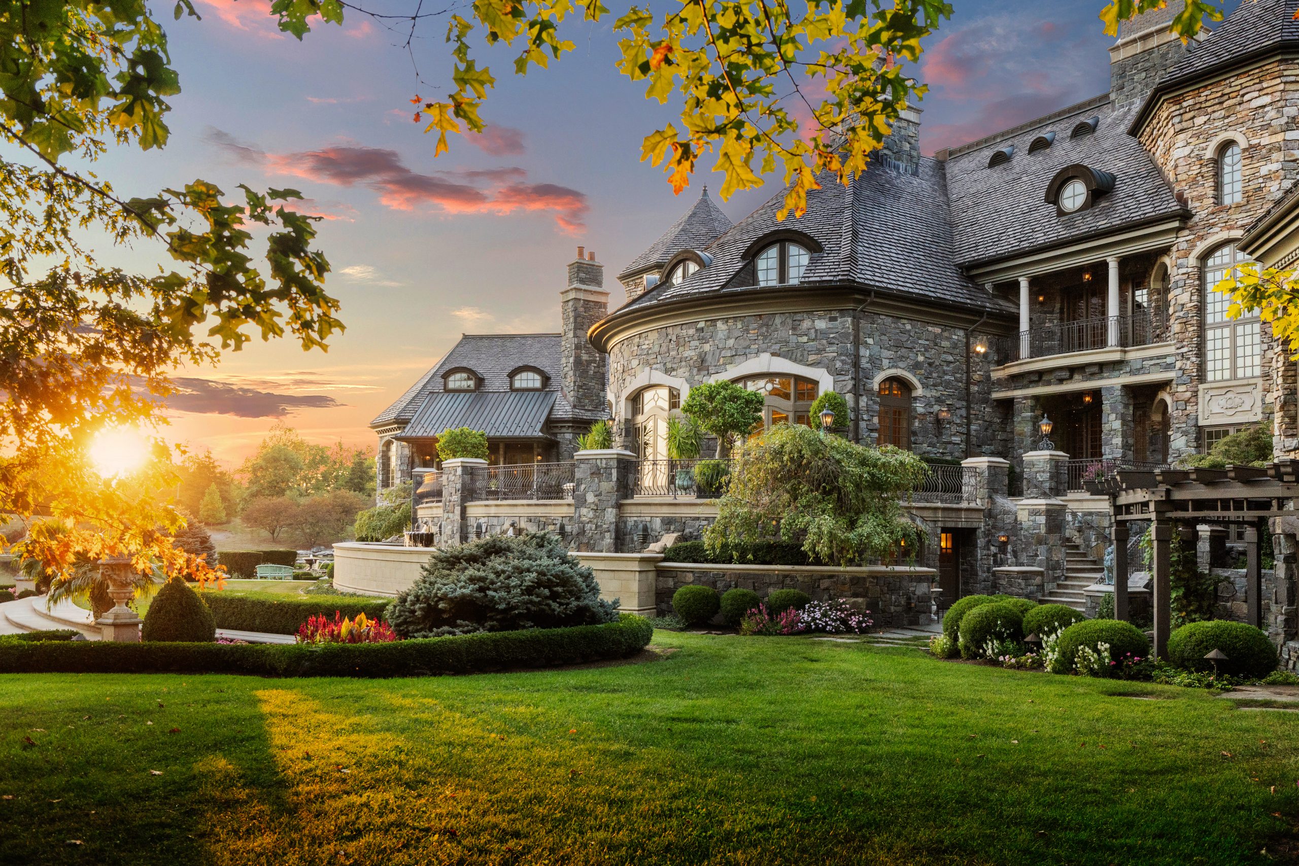 beautiful stone home at sunset