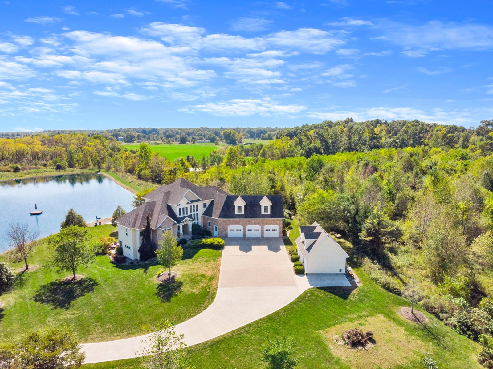 Aerial shot of a house on a pond
