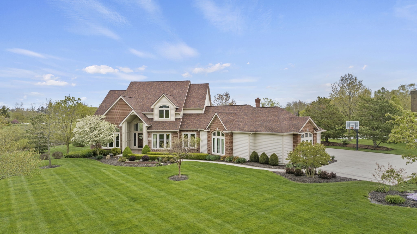Brown house with a nice lawn